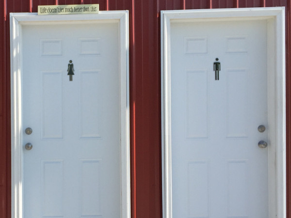 His & Her's Icons on Studio & Shop doors